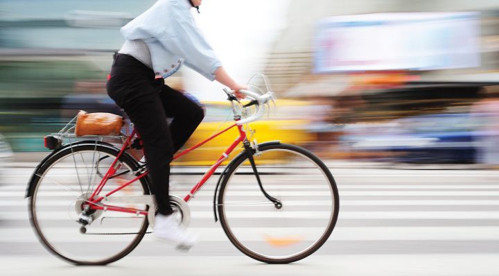 Bicyclist and colorful blurry background