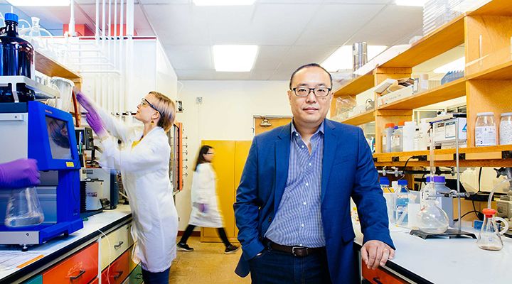 Man standing in a lab. 